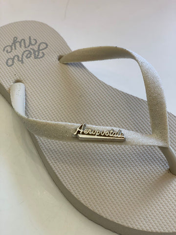 CHINELO FEM AERO NYC LOGO METAL CRUDO